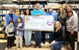 100+ Women Who Care Donates to New Lenox Family Services Food Pantry