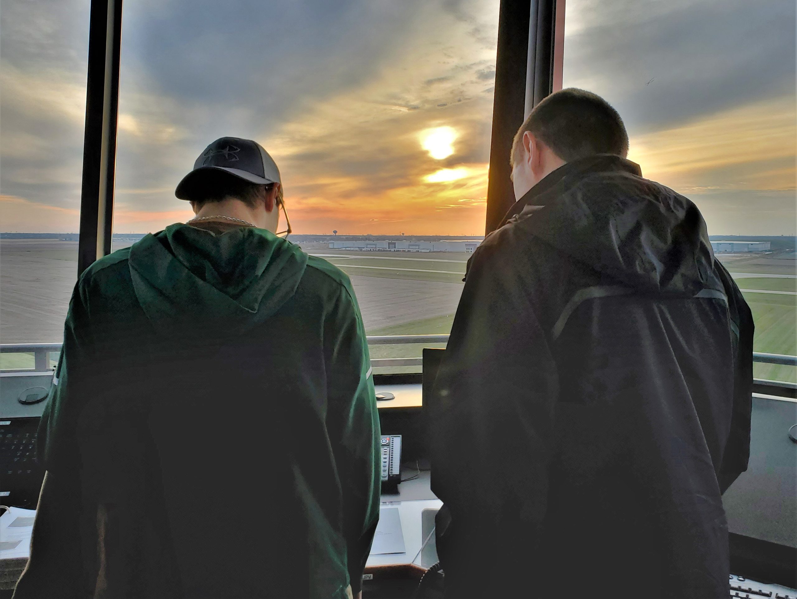  Two Lewis University Aviation students enjoy the view from the new FAA tower at the Lewis University Airport in Romeoville. The $8.2 million, eight-story tower, below, will be operational next month. 