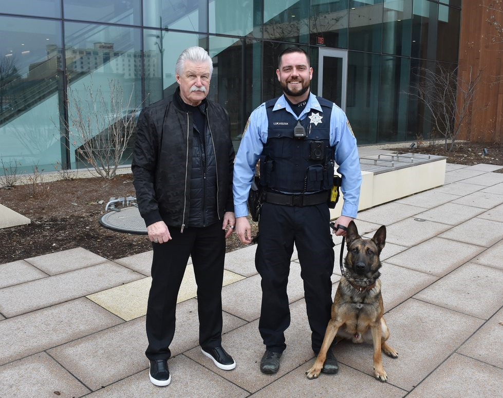 A new member of the Joliet Police Department is officially out on the streets – K-9 “Reno,” a 2-year-old Malinois-German Shepherd purchased by Will County State’s Attorney James W. Glasgow using money forfeited from drug dealers and money launderers. Reno is the 13th police K-9 Glasgow has provided to law enforcement agencies throughout Will County. A “dual-purpose” patrol K-9, Reno will also be trained in tracking, article and evidence search, building search and suspect area search in addition to his work in narcotics detention. Reno completed his basic training November 4. Pictured are Glasgow, Handler James Lukaszek and Reno. (Photo provided)