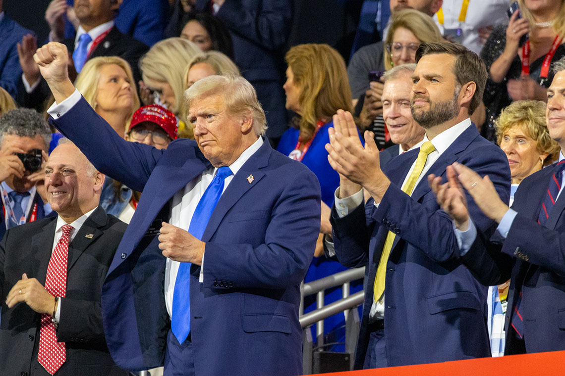 Convicted felon, assisnation attempt survivor and former president Donald Trump holds up a fist during the Republican National Convention. (Capitol News Illinois photo by Andrew Adams)