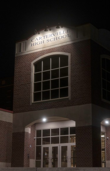 Light illuminating side of high school