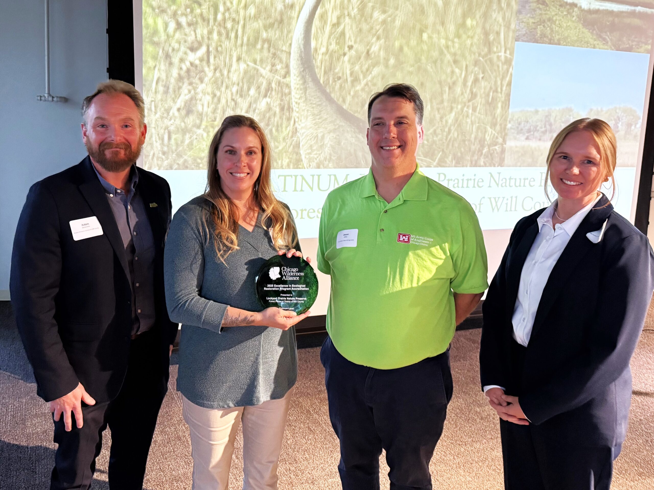From left, Forest Preserve Deputy Director Adam Oestmann; Forest Preserve restoration ecologist Barbara Sherwood; Jason Zylka, ecologist, US Army Corps of Engineers, Chicago District; and Laurie Ryan, co-chair for the Excellence in Ecological Restoration Program and plant ecologist for McHenry County Conservation District. (Chicago Wilderness Alliance photo)