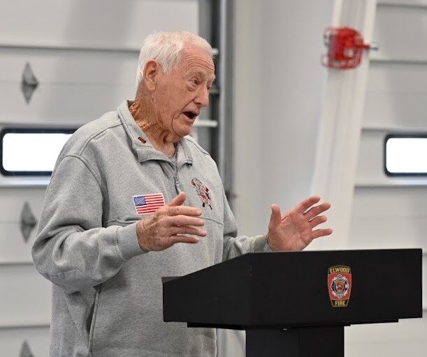 Norm Fanning addresses the crowd of family, friends and colleagues at the celebration honoring his years of service and the naming of the Elwood Fire District's training facility in his honor.(Photo by Stephanie Irvine)