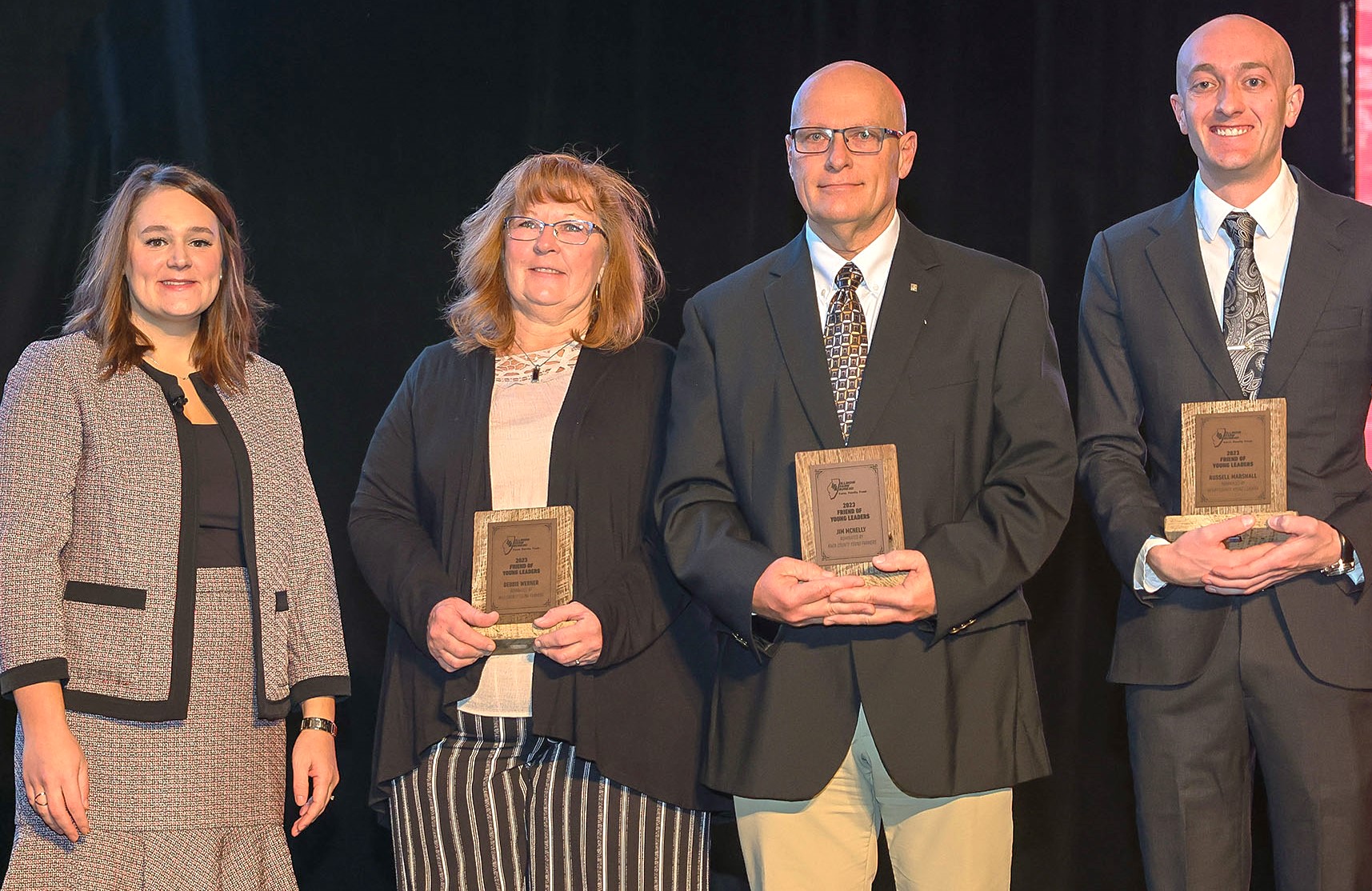 Pictured with Sadie Asher, IFB State Young Leaders Chair, are Young Leaders Support Award winners, from left, Debbie Werner, Will County; Jim McNelly, Knox County; and Logan Van Rheenen, accepting the award on behalf of Russell Marshall from Henry County.