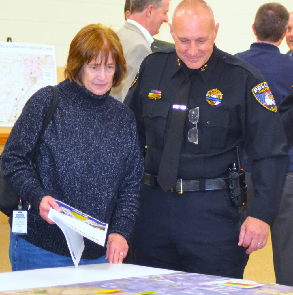I57meet24k-1 Christi Holston and Monee Deputy Police Chief Anthony Lazzaroni view the map of the area included in the I-57 Access Study. (Photo by Karen Haave)