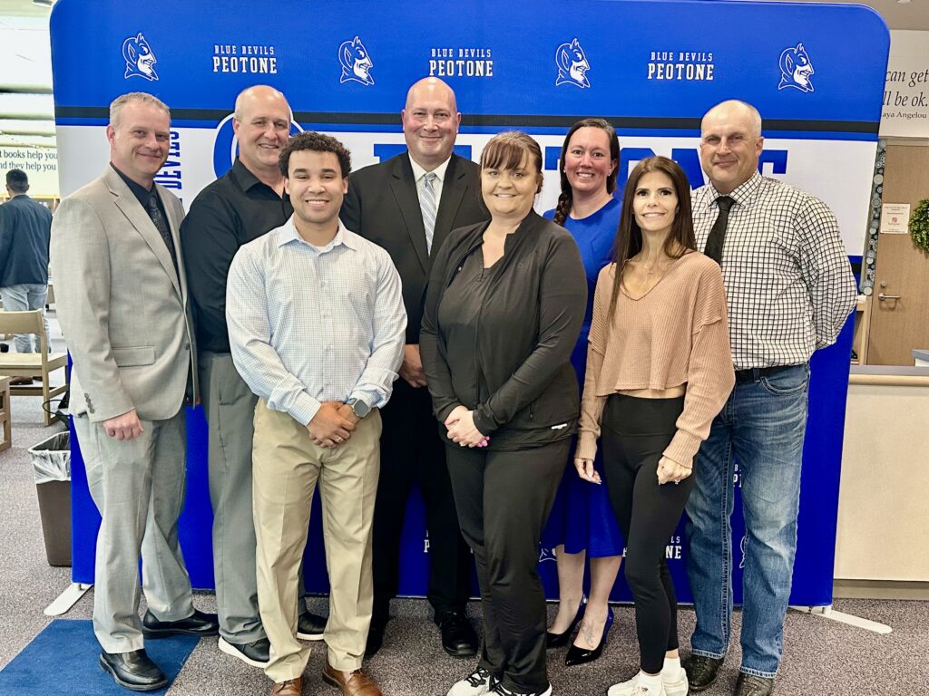 Dr. Mark Cohen, center, is flanked by members of the board, from left, Steven Clark, Tim Stoub, Mark Jones, Dawn Love, Ashley Stachniak, Jennifer Moe and Robert Janeliunas. (Photo by Andrea Arens)