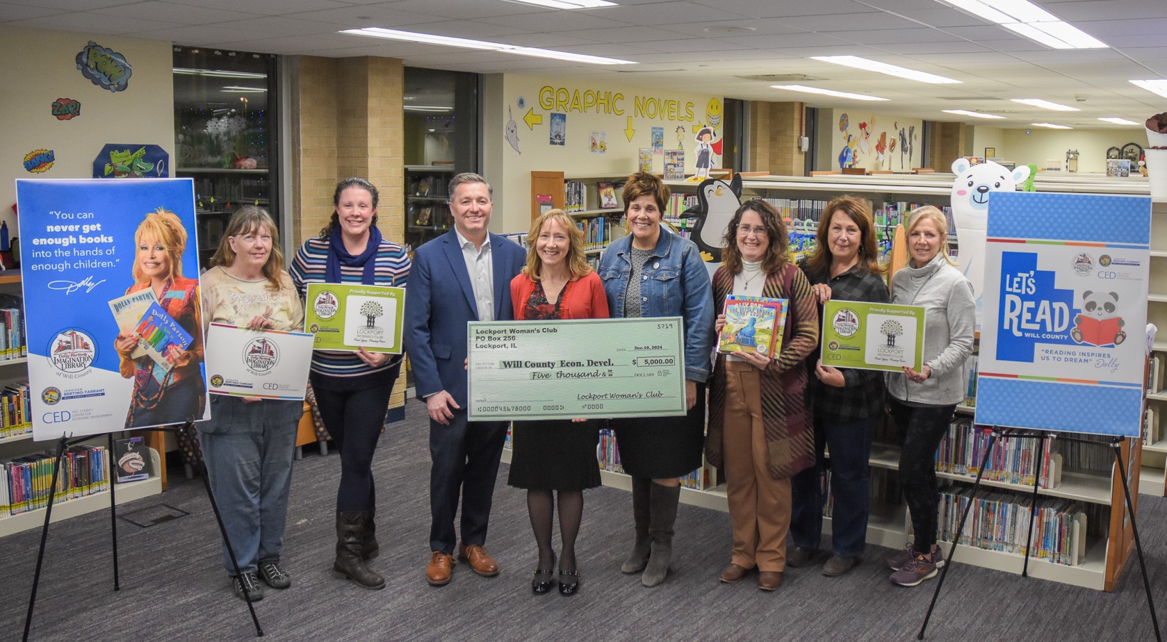 Members of the Lockport Woman’s Club present a $5,000 donation to the Imagination Library of Will County. The program, which mails free, high-quality, and age-appropriate books to children from birth to five, is the result of a partnership between Will County Executive Jennifer Bertino-Tarrant, the Will County Center for Economic Development, and The Dollywood Foundation.