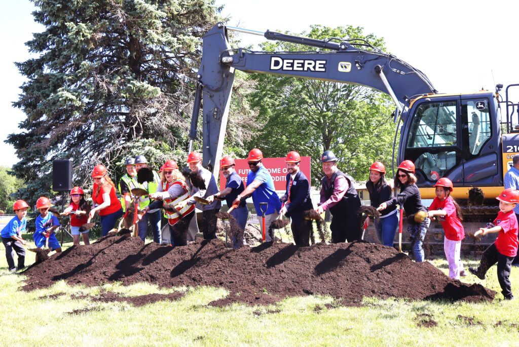 Getting ready to dig at the groundbreaking for the addition to Thomas Jefferson Elementary School in Joliet are, from left, Thomas Jefferson Elementary second-grader Emiliano Gonzalez; first-grade student Dy’Monte Holmes; kindergartener Ximena Martinez, Thomas Jefferson Elementary School Principal Consuelo Ramirez, Joliet Public Schools District 86 Superintendent Dr. Theresa Rouse; Joliet Public Schools District 86 Board of School Inspectors Jesse Smith and Naurice Moffett; Board of School Inspector President Matthew Pritz; third-grade student Thyda Nuth; and fourth-grader Kyler Cialdella.