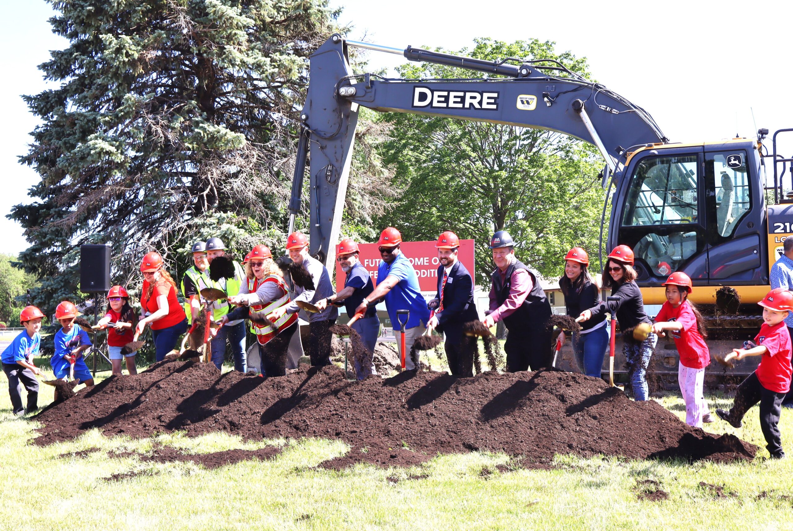 Getting ready to dig at the groundbreaking for the addition to Thomas Jefferson Elementary School in Joliet are, from left, Thomas Jefferson Elementary second-grader Emiliano Gonzalez; first-grade student Dy’Monte Holmes; kindergartener Ximena Martinez, Thomas Jefferson Elementary School Principal Consuelo Ramirez, Joliet Public Schools District 86 Superintendent Dr. Theresa Rouse; Joliet Public Schools District 86 Board of School Inspectors Jesse Smith and Naurice Moffett; Board of School Inspector President Matthew Pritz; third-grade student Thyda Nuth; and fourth-grader Kyler Cialdella.