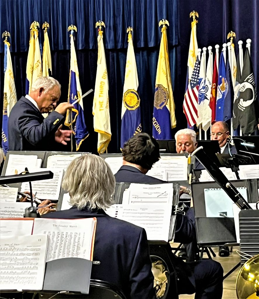 Under the direction of US Army Maj. Rick Ellenberger (Retired), the Joliet American Legion Band presented an array of musical arrangements at the 104th American Legion Convention in Springfield Saturday, July 15. Included within the concert performance for attending dignitaries from across the state, military branch flags were presented by the band's color guard Veronica Konow during the installation of department officers. Next stop for the band will be Charlotte, NC, to defend their National Champion title in August. (Photo provided)
