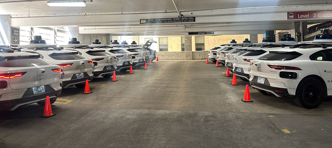 Waymos parked in garage