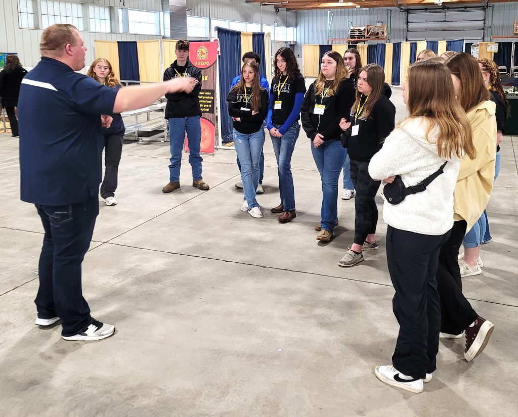 Dakota Cowger gives instructions to the FFA students from Peotone who helped with tour guides for the Ag Expo with just over 800 total students and teachers attending.