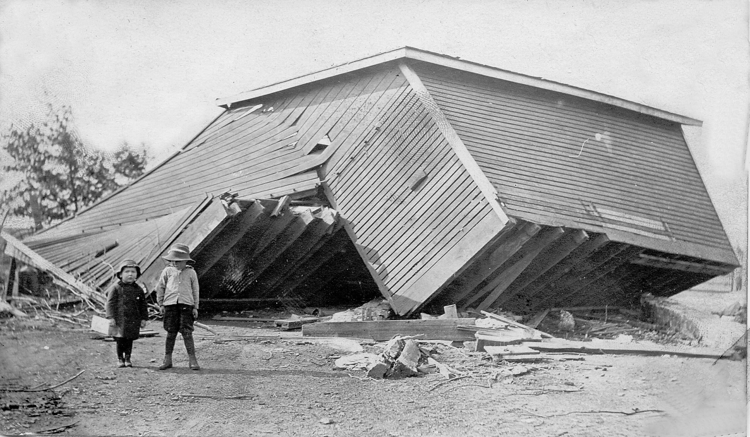 Dick Attaway shares this photo of his Dad, Chet, and his Uncle Paul in front of what's left of the Attaway corn crib after the 1917 "cyclone" that hit the farm on Old Route 66 where it crossed Jackson Creek