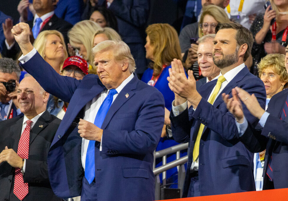 Convicted felon, assisnation attempt survivor and former president Donald Trump holds up a fist during the Republican National Convention. (Capitol News Illinois photo by Andrew Adams)