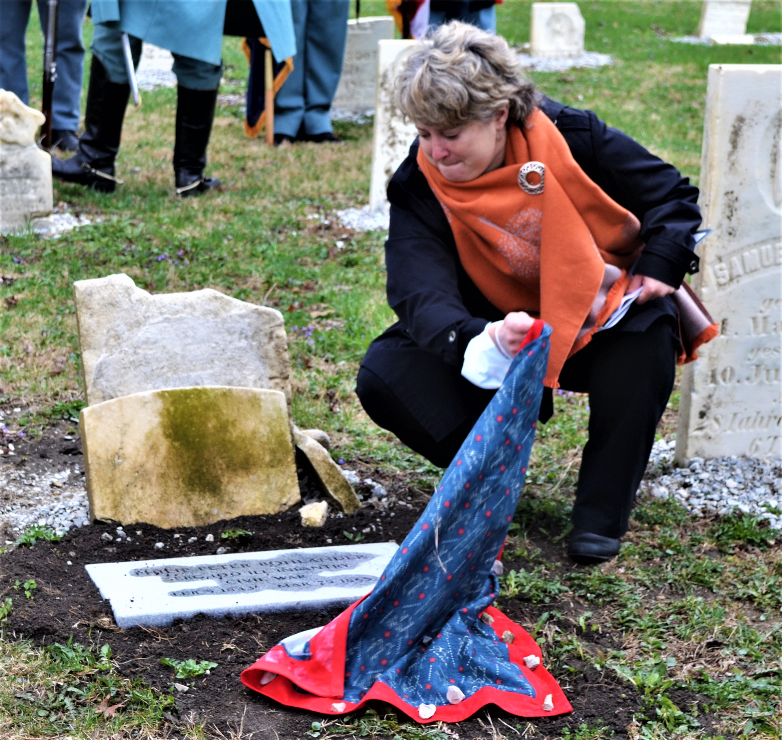 Rachel White, above, St. Paul Cemetery Board member, unveils the headstone honoring one of Monee’s Civil War veterans, Philip Bohlander, whose grave had gone unmarked. Below: the new marker, courtesy of the efforts of the Sauk Trail Chapter of the Daughters of the American Revolution and the St. Paul Cemetery Board. (Photos by Karen Haave)