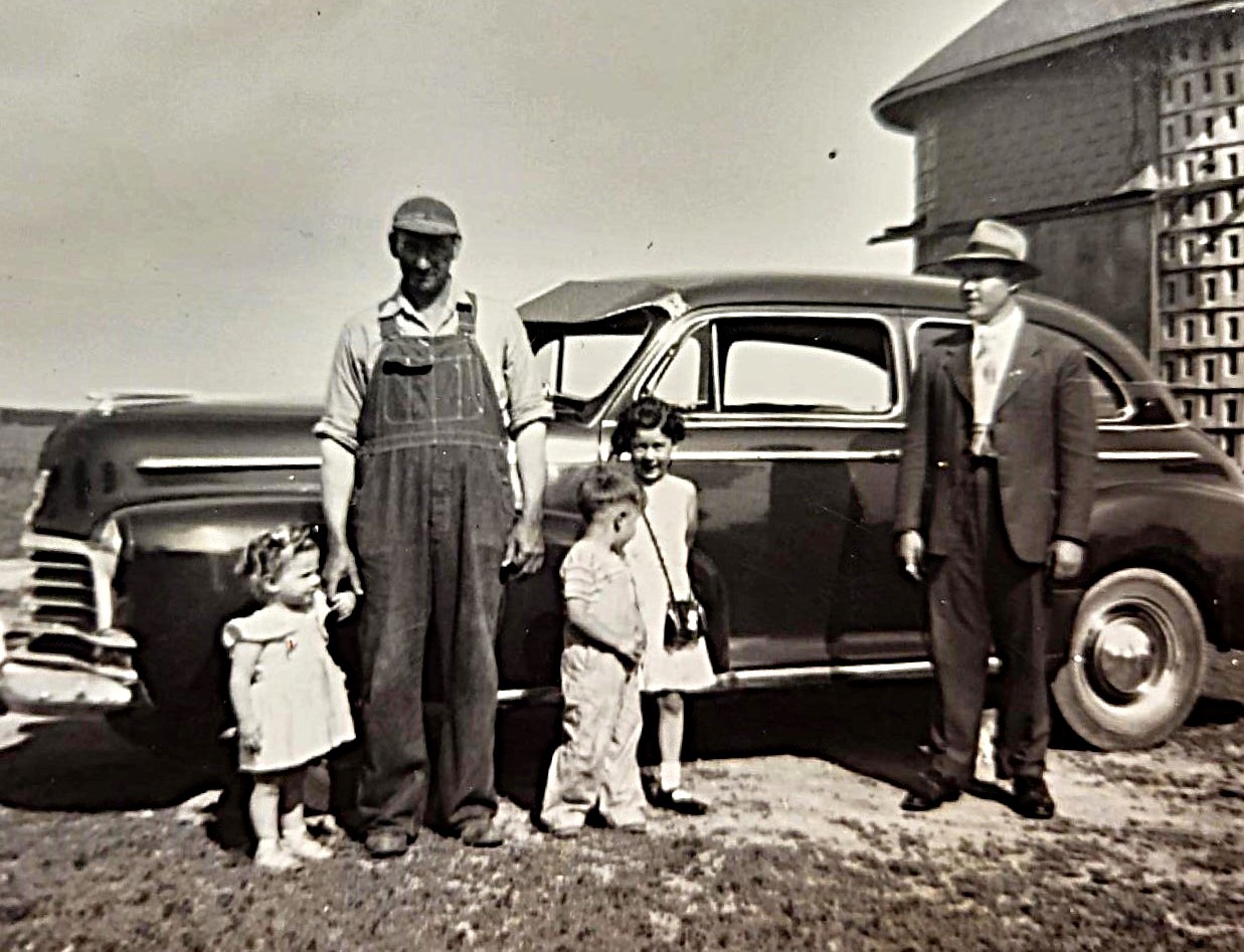 Posing in front of this spiffy car in 1947 are Arlene, Clarence, Roy and Jeanette Sangmeister, with Alfred Oehlerking.