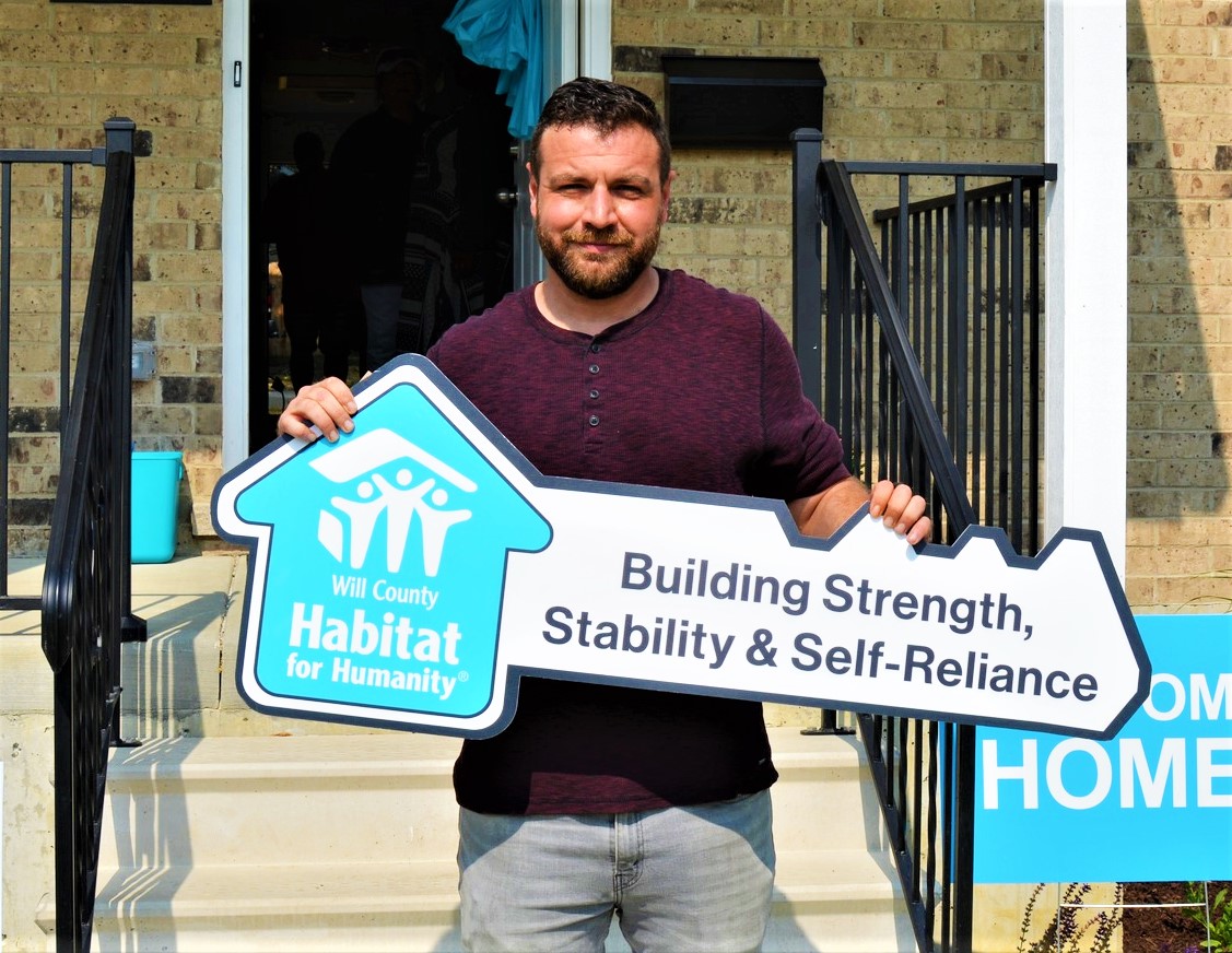 It took a couple years and a lot of sweat equity, but U.S. Army vet Joe Murdie, above, and his two kids have a new home in Crest Hill, courtesy of Habitat for Humanity and American Legion Post #52 in Romeoville. The project -- called the Ray Holloway House in memory of the late legion member and village clerk -- started two years ago, with Murdie doing a lot of work on it, as required by Habitat. But he also has chipped in on many other Habitat projects in the area. Members of Holloway's family were present for the official opening of the home on June 17, in addition to county and Crest Hill officials. 