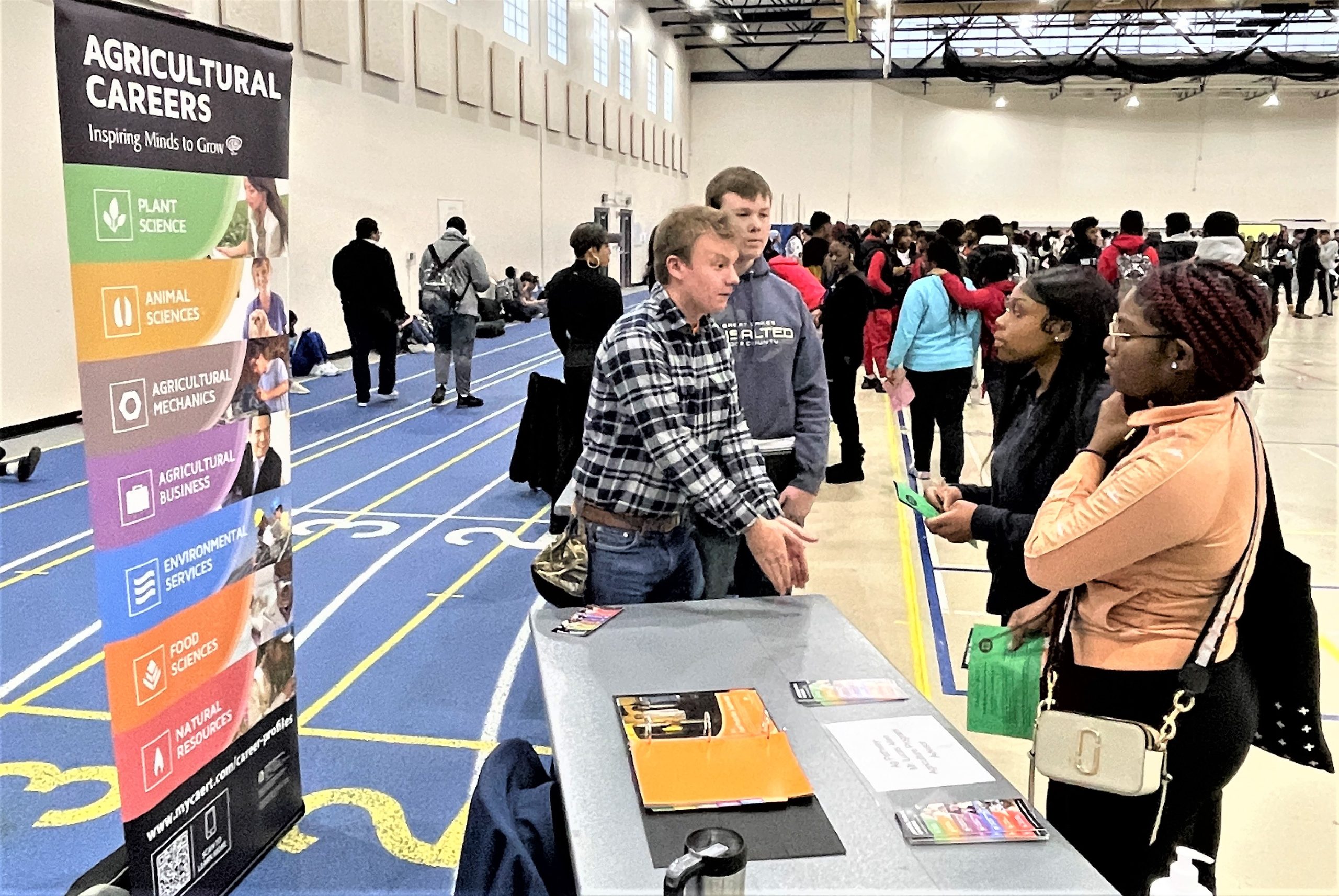 Ben Deutsch, a Junior at Crete-Monee High School, explains to classmates the importance of joining the new agriculture courses planned for next year at the CMHS Elective Fair on January 20.