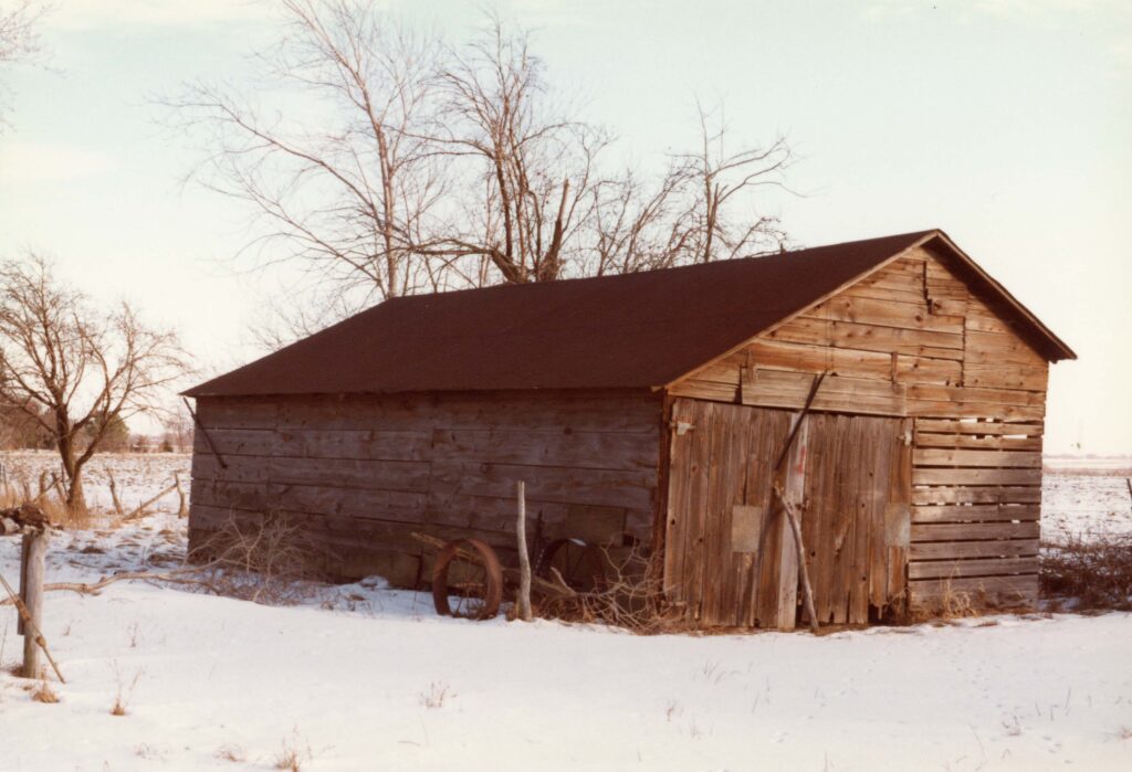 The Crete Historical Society turned in this photo of an old corn crib and shed taken around 1982 in Eastern Will County. The contents of the shed included a 1939 F-20 Tractor and a 3 bottom plow. All are now gone. 