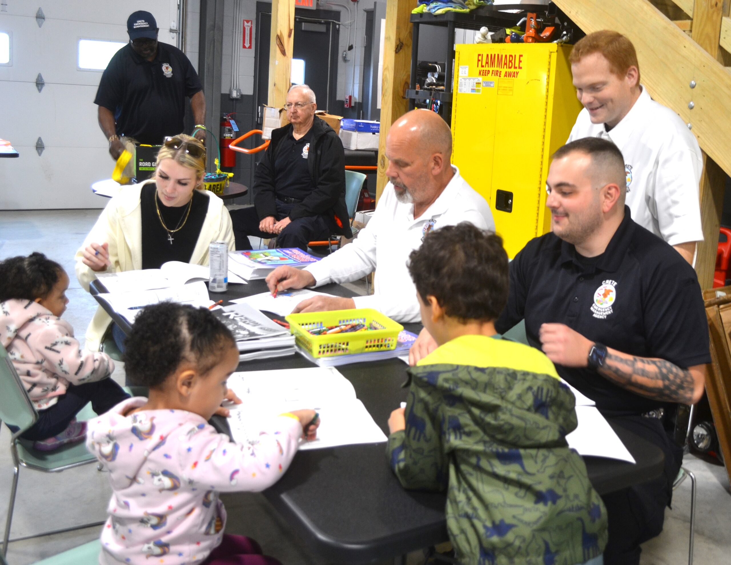 Crete EMA staff and responders joined kids at the activities table at a recent open house to draw and color, and talk about how emergency management serves the community. (Photo by Karen Haave)