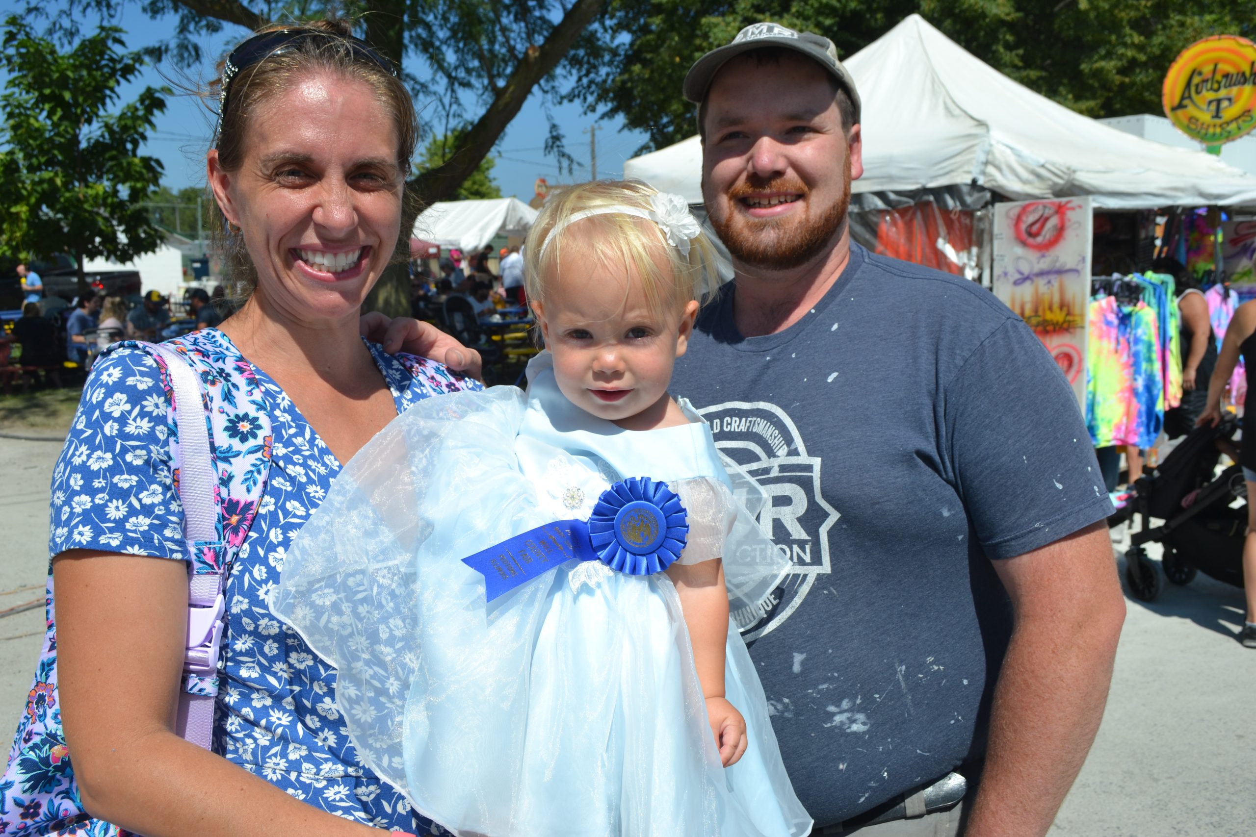 Ruth Rosenthal, 17, months, poses with Mom and Dad Hannah and Matt Rosenthal of Monee, after winning first place in her category (Girls, 15-18 months) in the Baby Contest at the fair.