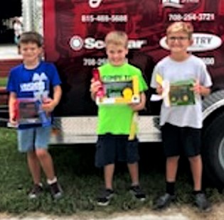  During the class “B” pedal pull competition at the Will County Fair, the winners were, from left, First Place, with a pull of 35 foot 4 inches, was Logan Johnston of Peotone; Second Place went to Evan Sparenberg of Mazon with a pull of 23 foot 1 inch; and Third Place went to Jase Netrual of Mazon with a pull of 23 foot 1 inch.