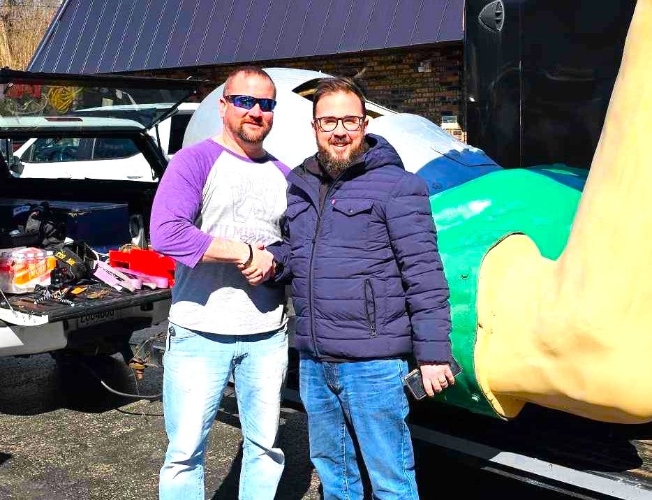Ryan Jandura, left, organizer of Save The Gemini Giant, shakes hands with Greg Peerbolte, Chief Executive Officer of the Joliet Area Historical Museum. The museum, aided by a $275,000 state grant, bought the Giant at auction and is having it moved to South Island Park, so it will stay in Wilmington. (Photos courtesy of Ryan Jandura)