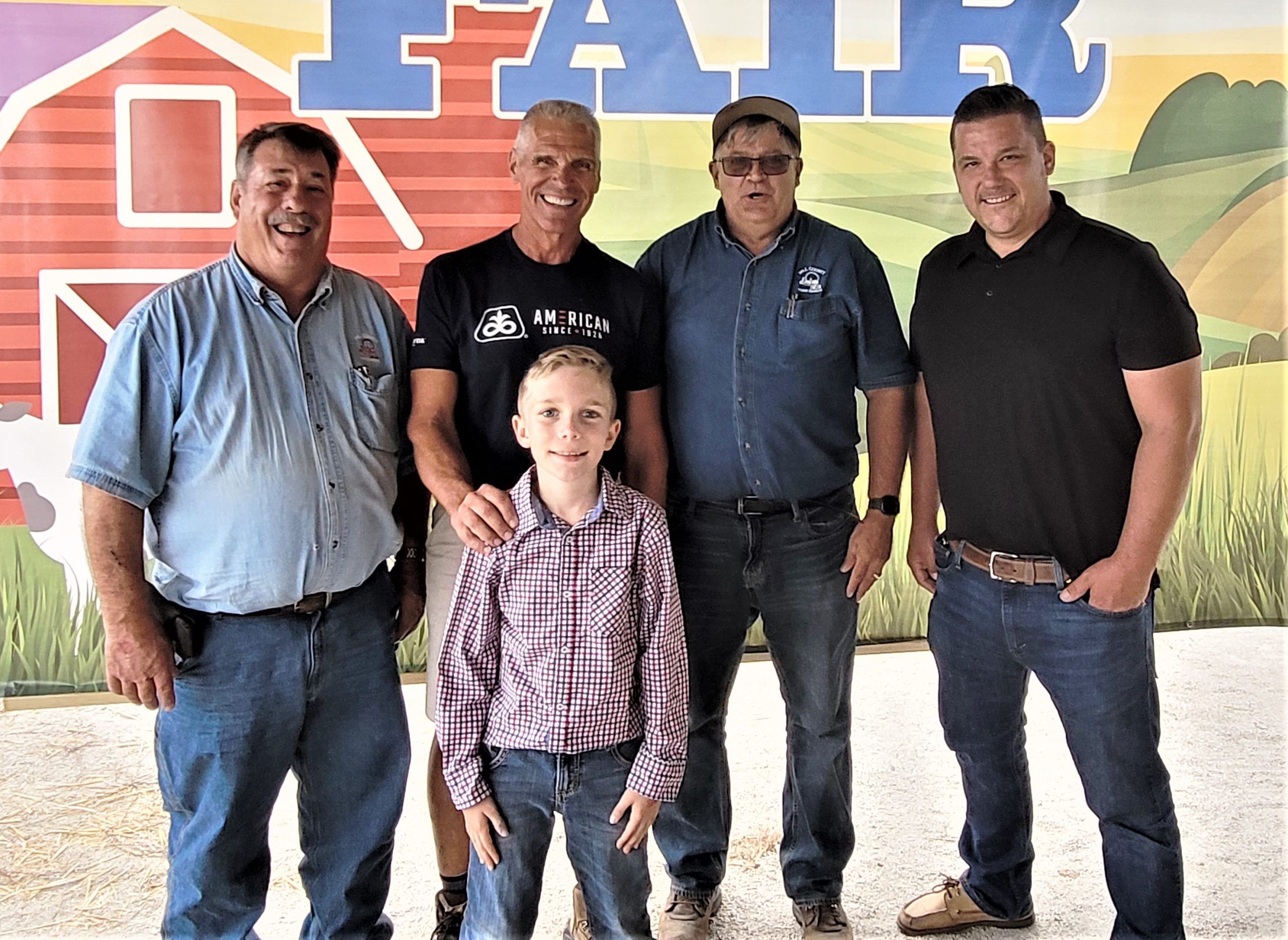 Each year, the Will County Farm Bureau has purchased animals during the 4H livestock auction, this time on August 26, to support the hard work of the 4H kids, and this year was no different. One of the animals they purchased and gave back belonged to Henry Reus Jr., his first time showing, and he was the Reserve Grand Champion. Pictured from left, with Henry Reus Jr. in the front, Steve Warrick Sr., Dave Kestel, Mark Schneidewind and Brad Metzger. Henry is the grandson of the late Glenn Ginder. Congratulations to all of the 4H livestock auction participants.