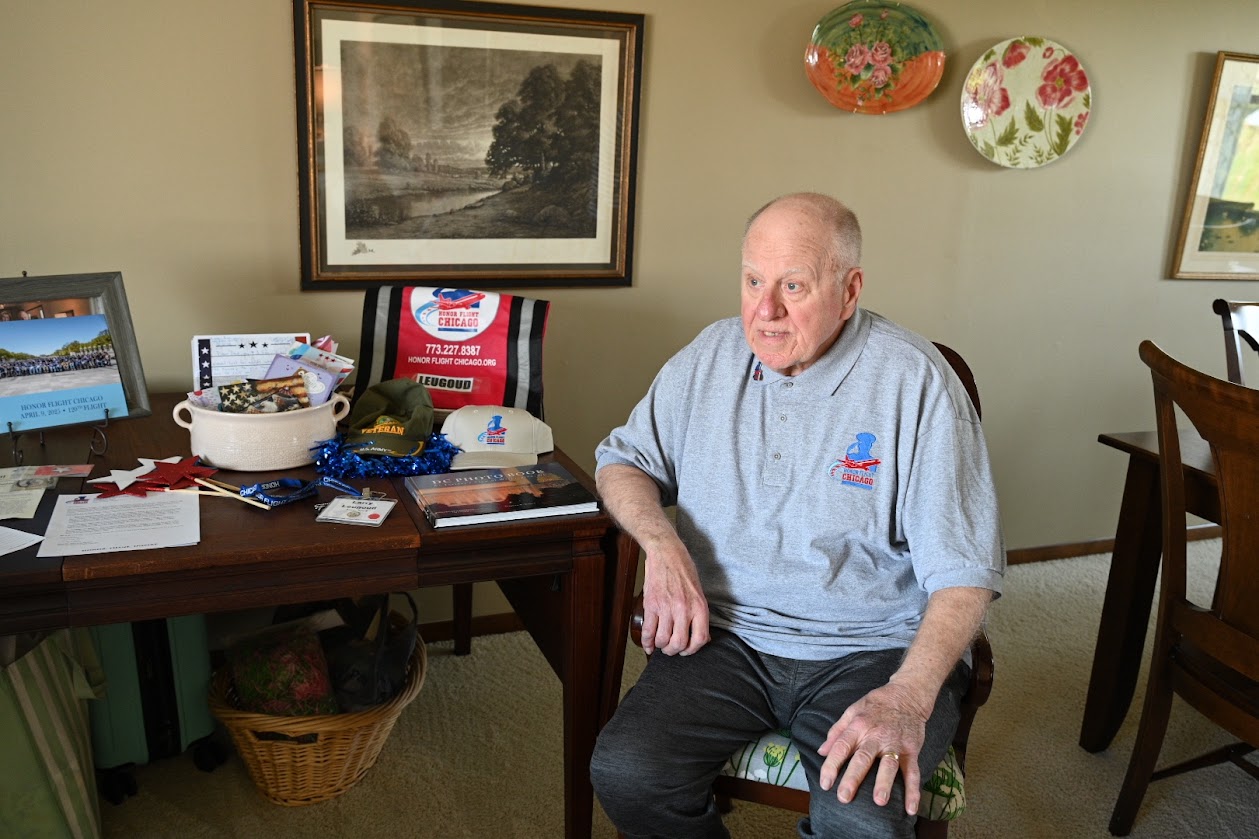 Vietnam-era Army veteran Larry Leugoud of Peotone poses with the keepsakes he received from his Honor Flight on April 9. (Photo by Stephanie Irvine)