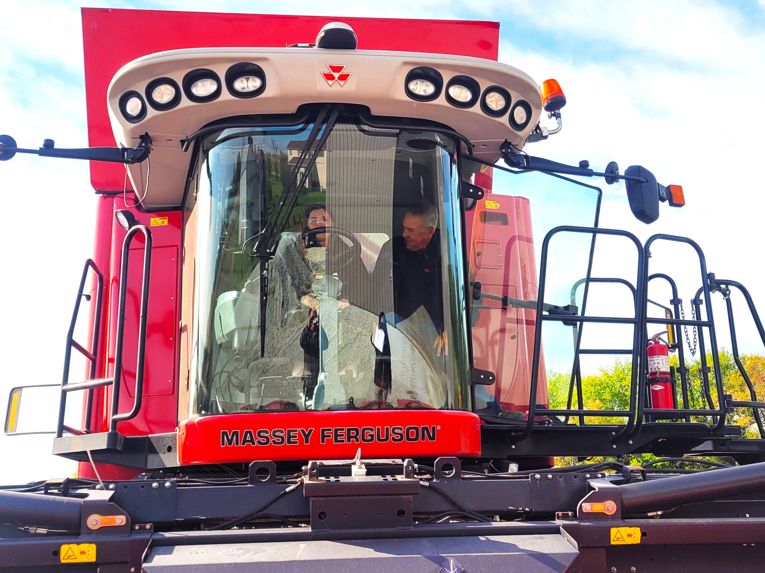 U.S. Rep. Jonathan Jackson and his staff attended a farm meeting recently at the Rick and Andera Johnson farm to review the farm bill, aviation fuel, crop insurance and experiencing farming life. Unfortunately, the combine rides had to be cancelled due to wet fields. Here, Marrissa Smith listens for instruction from Rick Johnson on how to place the combine into drive. 