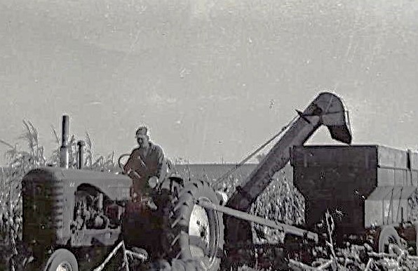 jimkestelharvest The Kestels share this photo of Anthony at the combine and Frank on the tractor in the background, husking corn in October 1952.