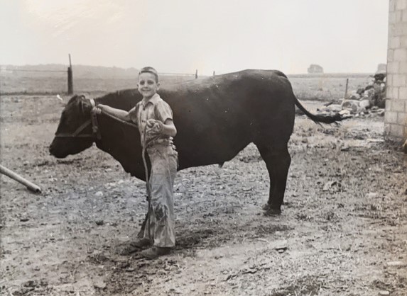 Karen Parks' Dad, George Archibald, loved to show animals for 4-H. And she shares this one of him as a youngster.