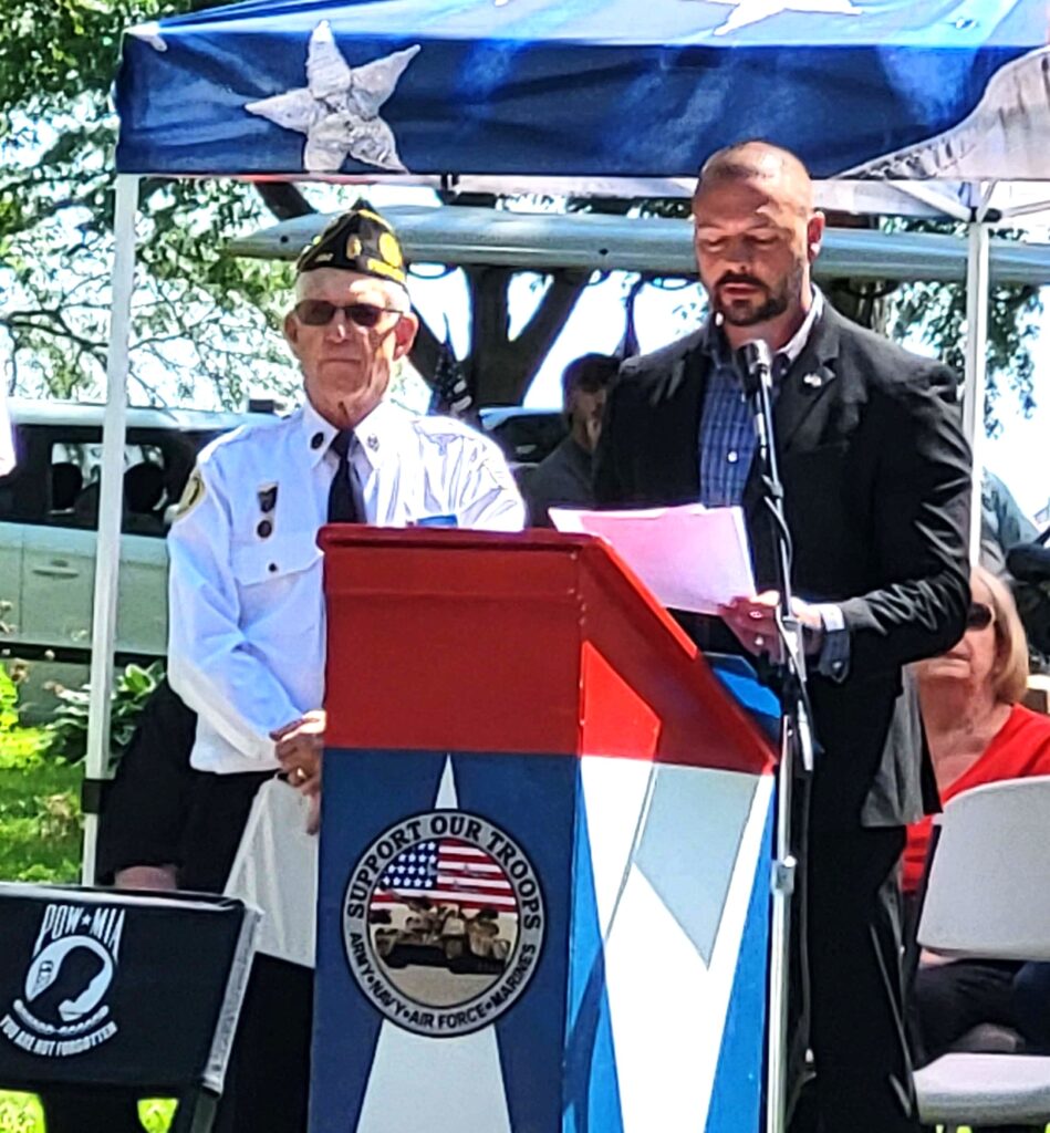 Peotone veteran Brian C. Thompson addresses the crowd at the Peotone American Legion Post 392 Ceremony. (Photo by Debbie Werner)