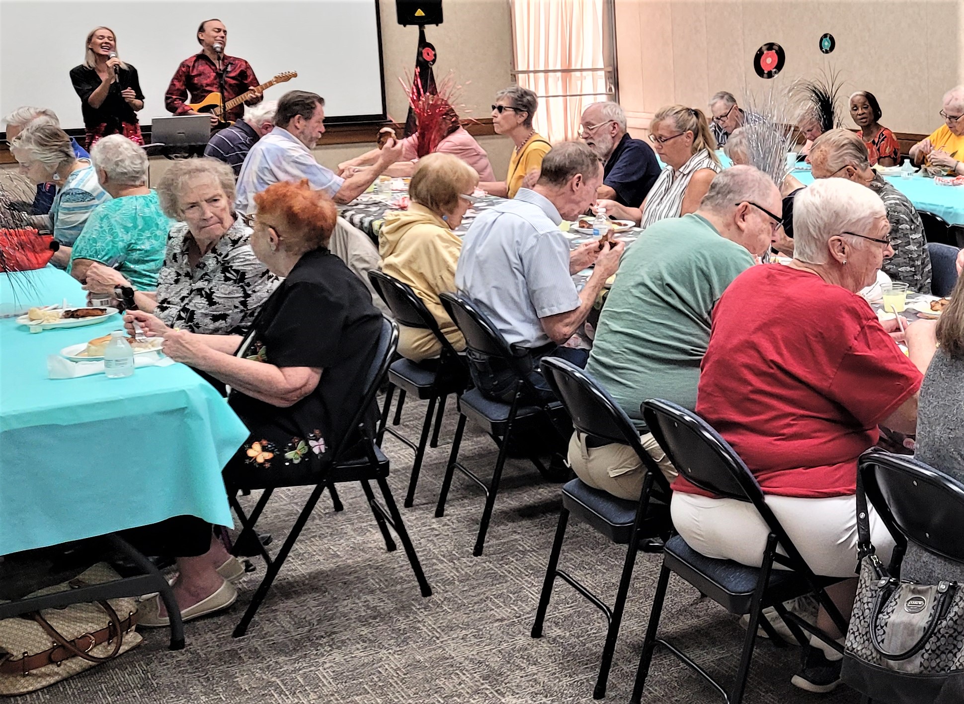 The Will County Farm Bureau PrimeTimers group gathers for their annual picnic on the Farm Bureau grounds on Wednesday, Aug. 2, and enjoy the entertainment of “Mike and Traci.” The Young Farmers Committee cooked and served a pork chop meal.