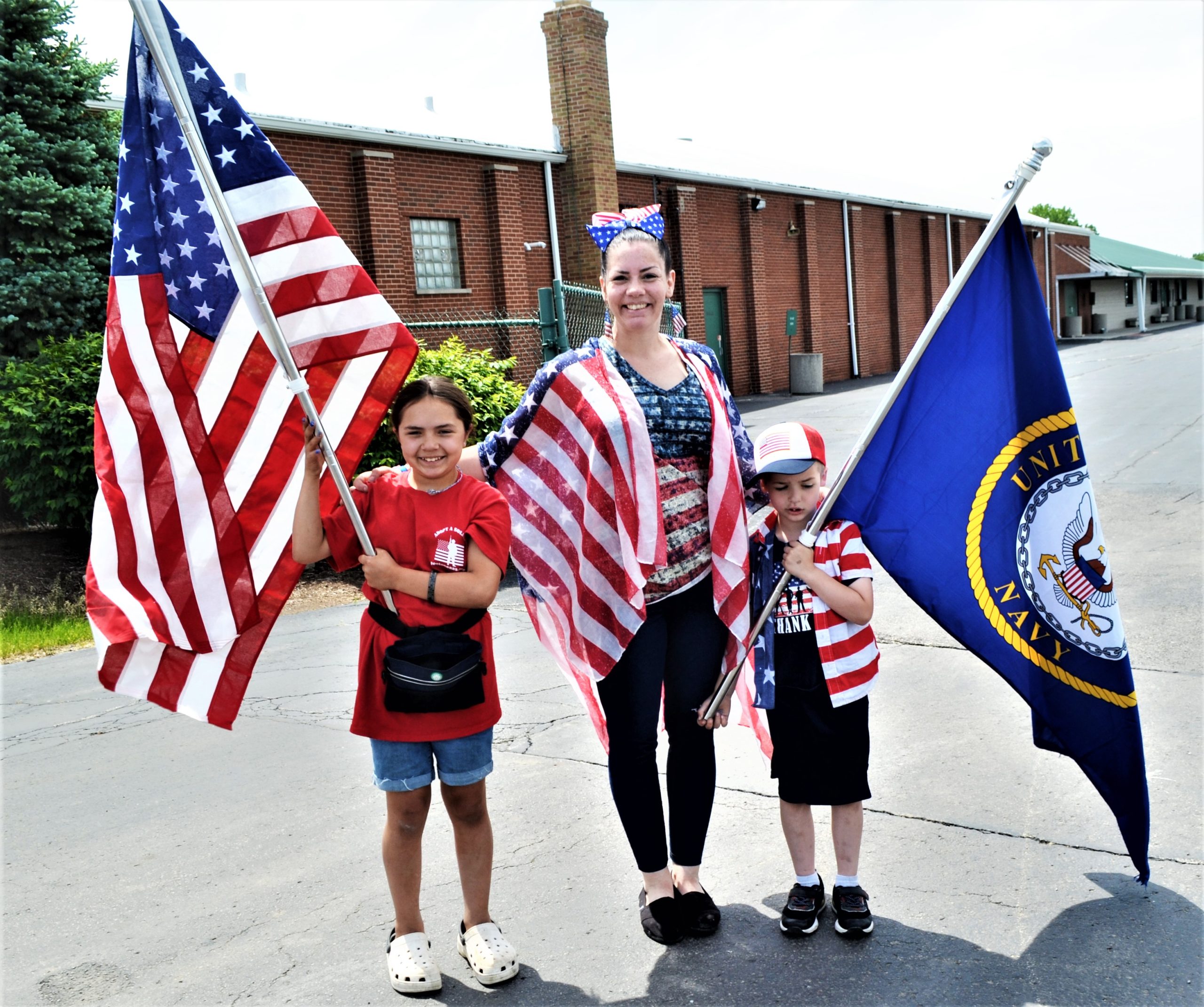 Navy Vet Brittany Payne marched with her son Colton and Penelope Pecho, the daughter of another Rucker who marched. Payne said Colton has been her reason to live through PTSD, something many people don't understand.(Photo by Karen Haave)