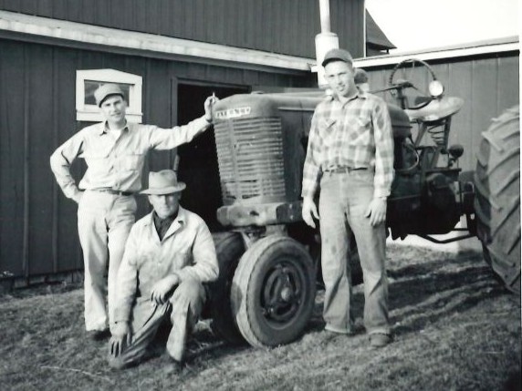 Walter Seggebruch, center, poses with his sons-in-law, John Martenson, left, and Rich Lorenz on the farm in 1955.