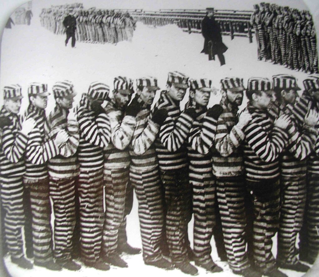 strip lock A photo of prisoners at the penitentiary, during the winter. They wore stripes for several reasons, one of which is that if they should escape they would be easily noticeable. It did not stop them from planning them though.