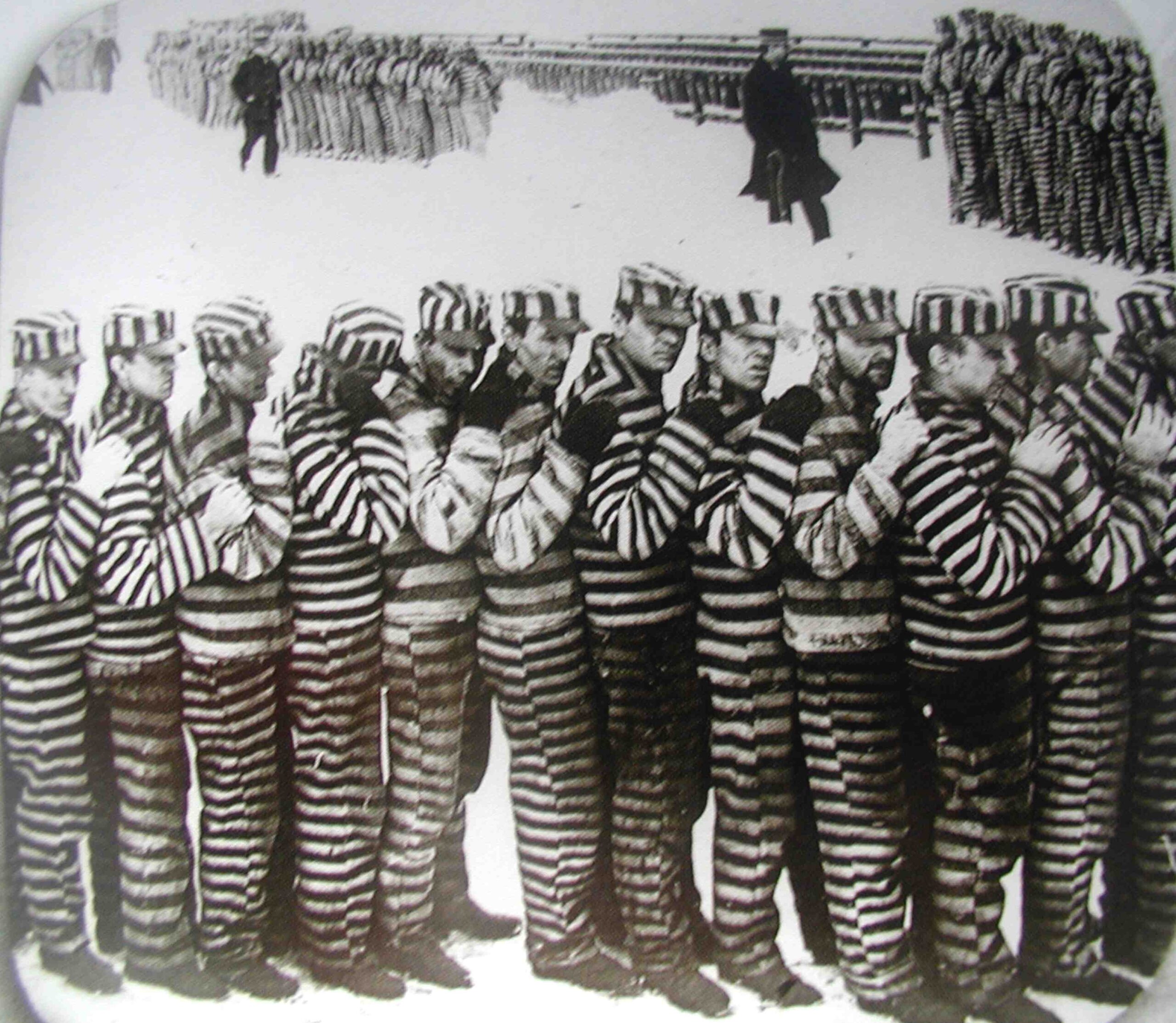 A photo of prisoners at the penitentiary, during the winter. They wore stripes for several reasons, one of which is that if they should escape they would be easily noticeable. It did not stop them from planning them though.