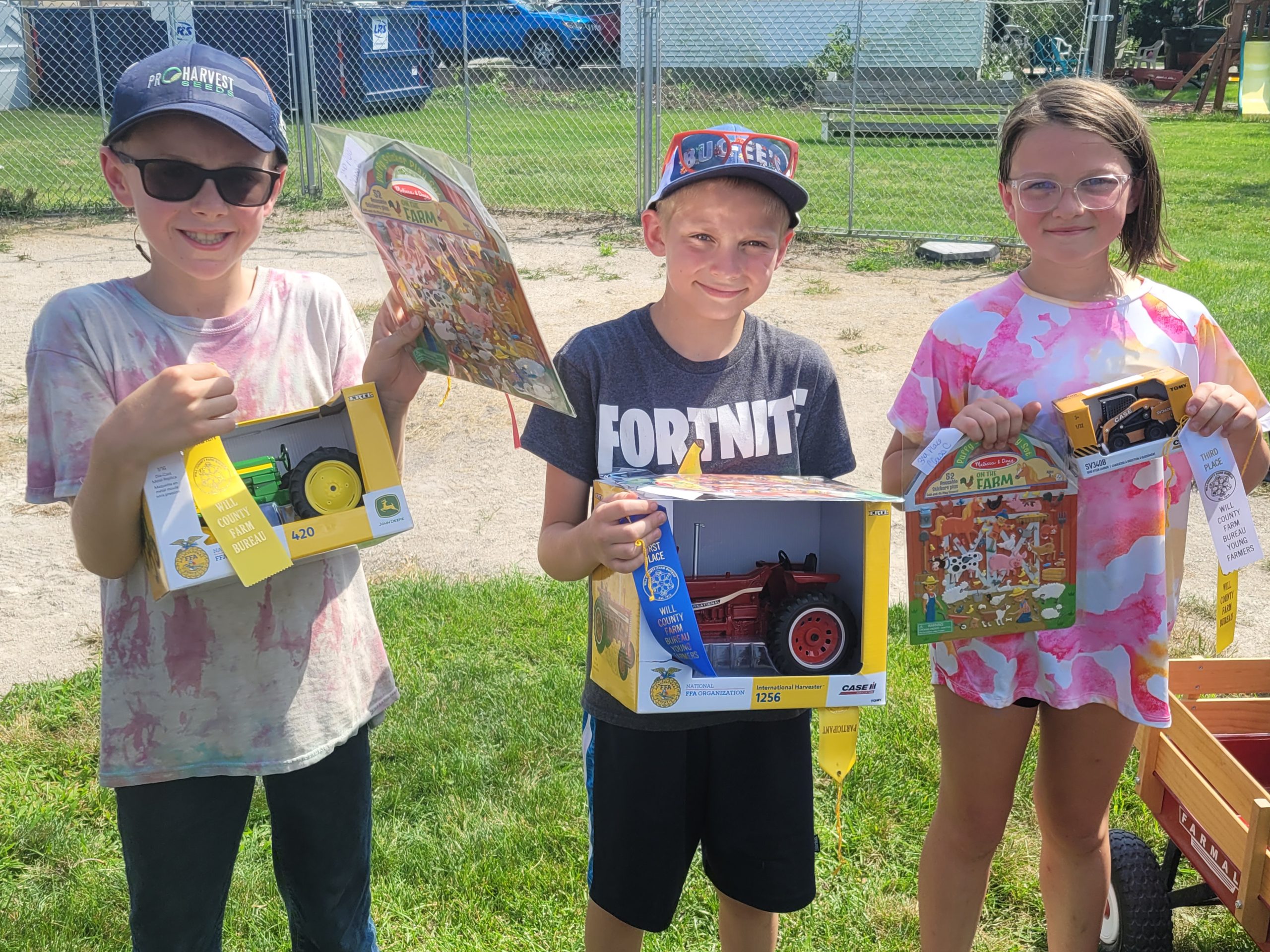 The top 3 pulls in Class C were, from left, Second Place, Benjamin Floyd of Wilmington with a pull of 22 foot 3 inches; First Place, Gage Sorensen of Wilmington with a pull of 23 foot 1 inch; and Third Place went to Grace Gallagher of Manhattan with a pull of 21 foot 4 inches. The prizes were donated by Werner Farms.