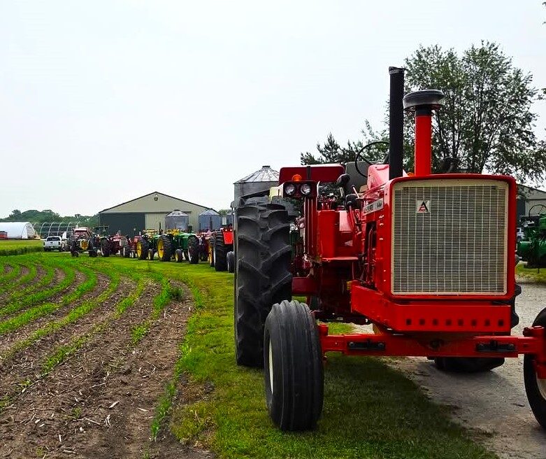 tractor25-3 Thirty tractor drivers and 10 riders chugged along a 41-mile ride through the Will County countryside June 7 as part of the annual Vintage Tractor Ride sponsored by the Will County Threshermen's Association. The route began at the WCTA Show-grounds at Spiess Farm in Manhattan, and with a Will County Sheriff's Police escort, traveled to the Steve Issert Farm in Wilmington for lunch prepared by Brian Kestel and Brian Hennings before heading back. Right, Wiley Sawyer traveled from Waterman on a JD 630 for the event. Below, the group shows a good time was had by all. (Photos by Pam Robbins)