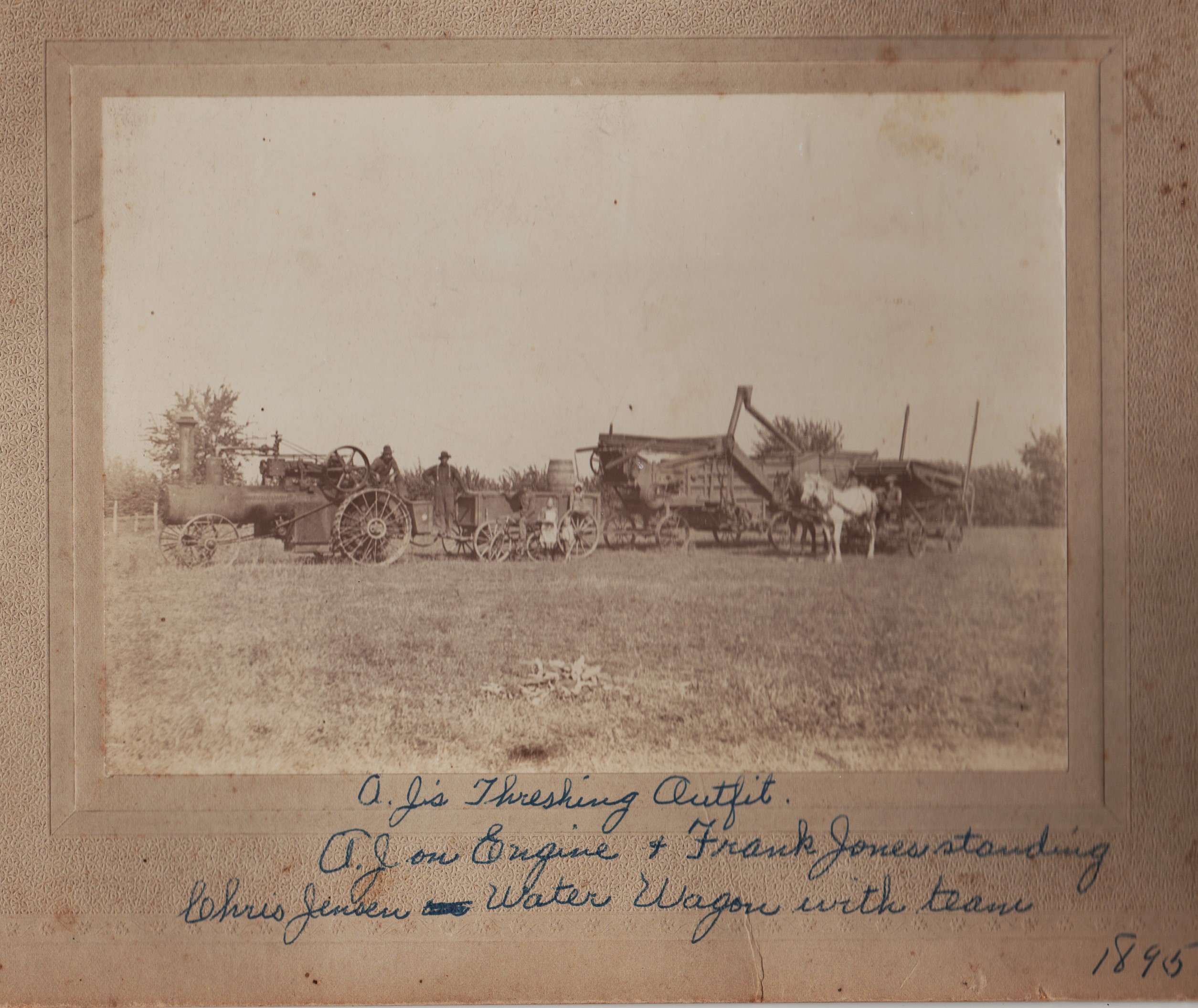 Judy Brown of Lockport dug up this oldie but goodie from 1895, taken at her grandfather, Charles Burkhardt's, farm in Goodfarm Township in Grundy County. Still in the afterglow of the recent 62nd annual Threshermen's Show, this picture shows "A.J.'s Threshing Outfit," with A.J. being Charles' father. A.J. is on the engine, at left, with Frank Jones standing. To the right, a Mr. Jensen (I can't read his first name) is manning the water wagon and the team of horses.