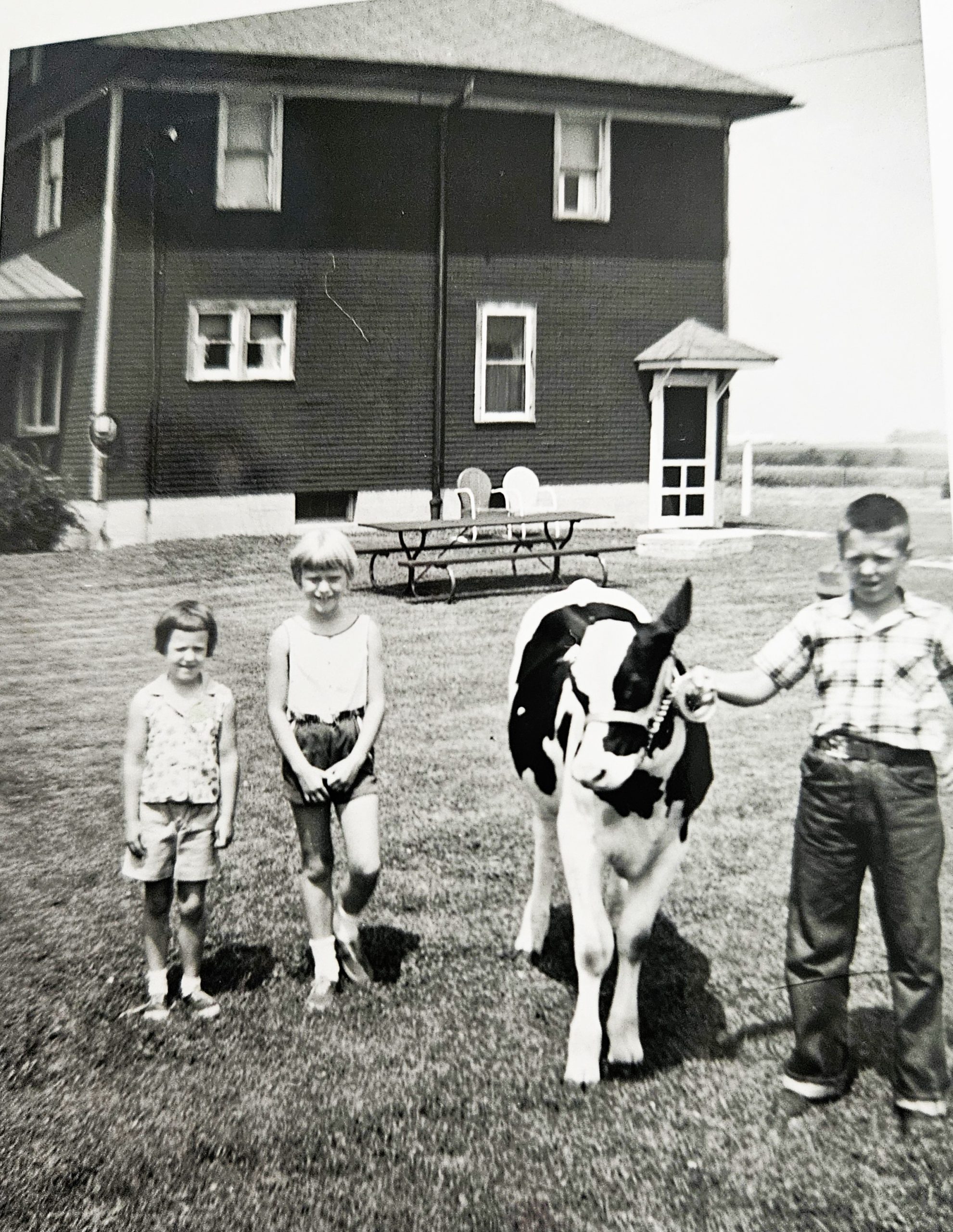 Lee and Jeanette Werner and Kathy Heisner pose with Lee's first entry in the 4-H show in 1960.