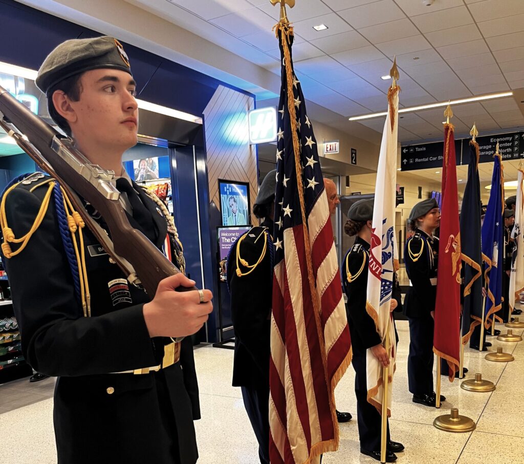 welcome25 Among the welcome home festivities for the returning 111 Vietnam Veterans aboard Honor Flight Chicago #121 was the Joliet Central Army ROTC, which included their nine-member presentation squadron and an additional 48 cadets. Under the direction of Major (Ret.) Phillip Jayko and MSG (Ret) Gary McClellan, presentation of colors was made during the opening ceremony and the service branch flags were presented for the US flag line walk through. As the veterans arrived to meet their friends and loved ones, the JROTC led the final segment of the Parade of Honor accompanied with patriotic music by the Frankfort Brass Band under the direction of Mike Orenic.(Submitted Photo)