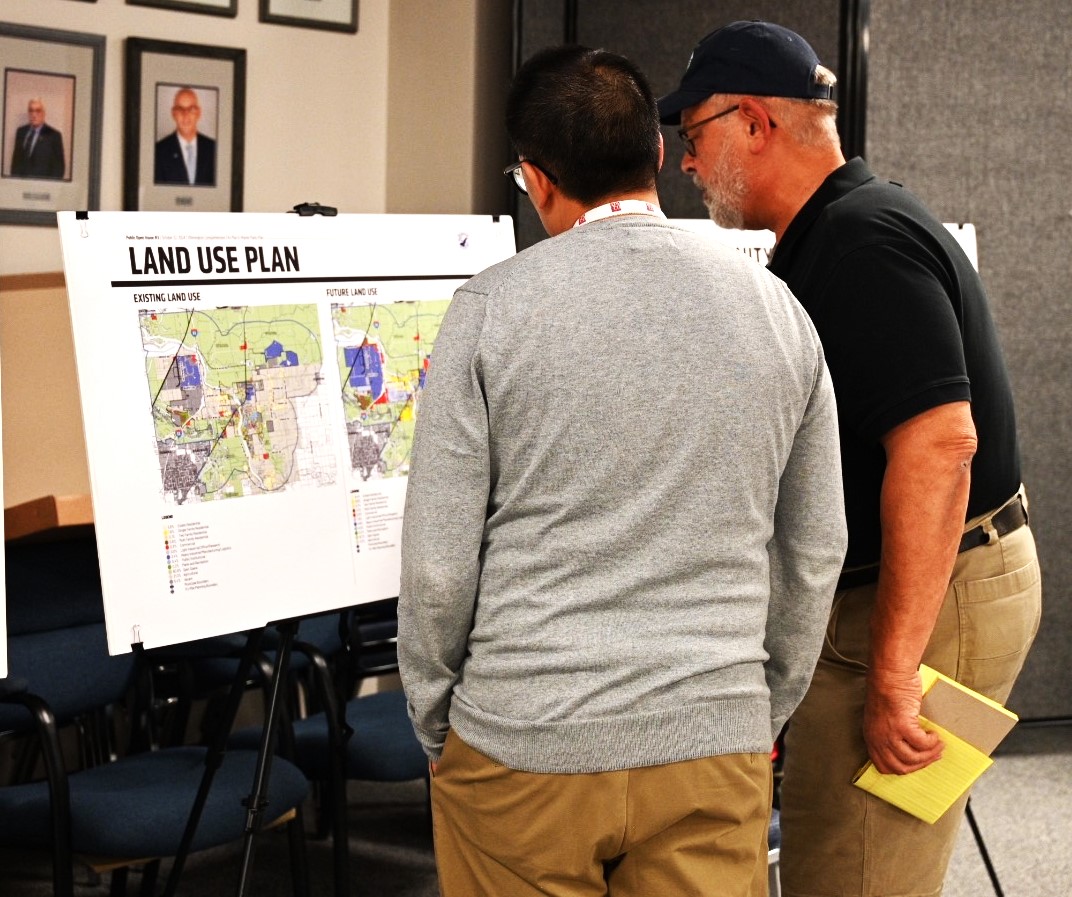 Joseph Roth, right, talks with Principal Planner Todd Vanadilok while viewing a map of the area.(Photo by Stephanie Irvine)